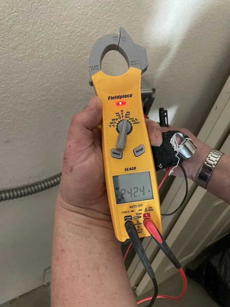 Voltage testing with clamp meter during Recessed Lighting Installation in Sharon